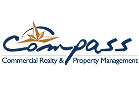 BOMA BEST - Logo of Compass Commercial Realty & Property Management, featuring stylized text and a graphic resembling a compass rose above the company name, showcasing their expertise in guiding you home with BOMA BEST certified standards.